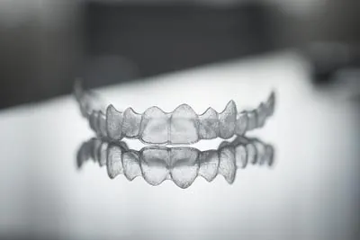 Invisalign clear aligners laying on a table