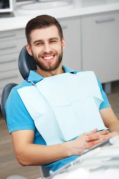 Ouellette Family Dentistry patient smiling during his cosmetic dentistry appointment